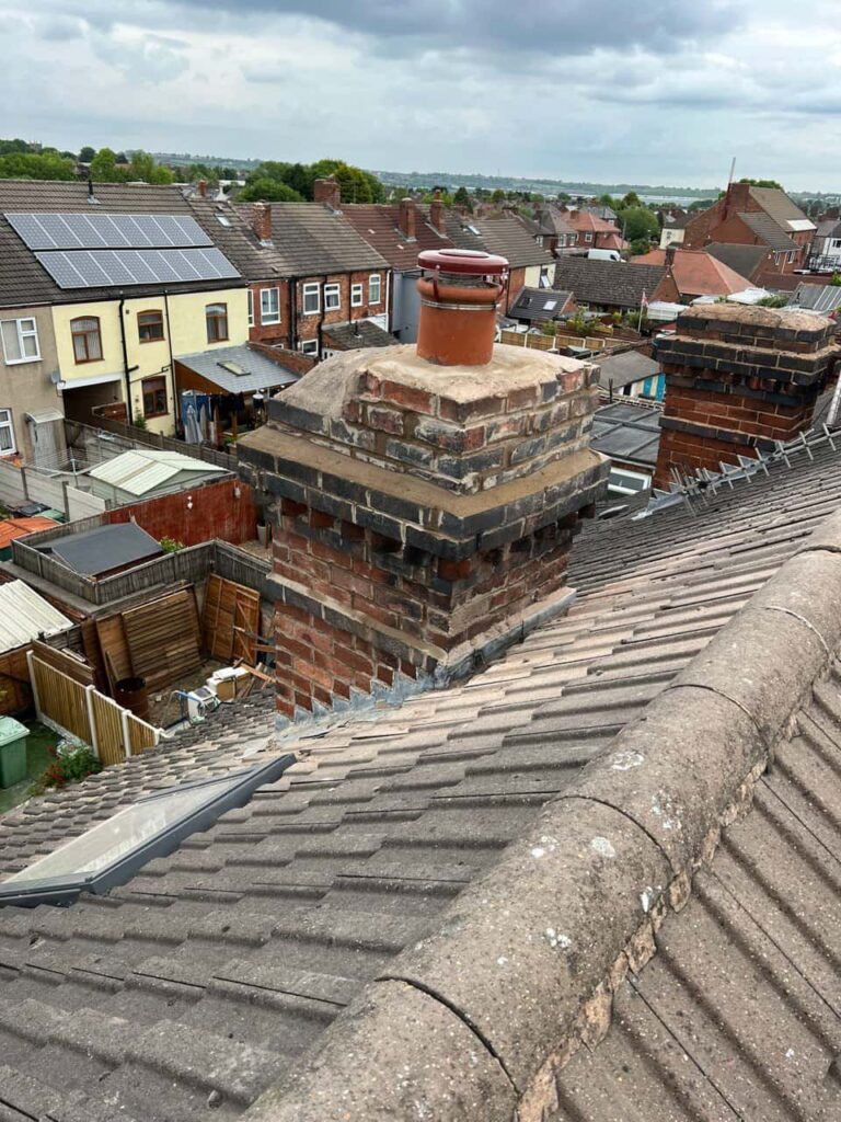 This is a photo taken from a roof which is being repaired by Midhurst Roofing Repairs, it shows a street of houses, and their roofs